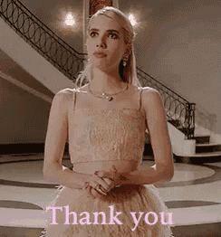 a woman in a dress is standing in front of a staircase and saying `` thank you '' .