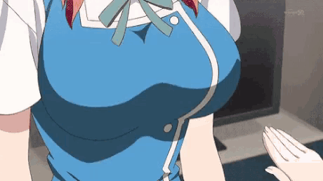a close up of a woman 's breasts in a blue dress and white shirt .