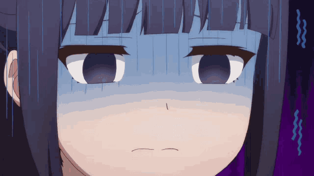 a close up of a girl 's face with a surprised expression