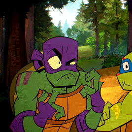 two teenage mutant ninja turtles are standing in the woods