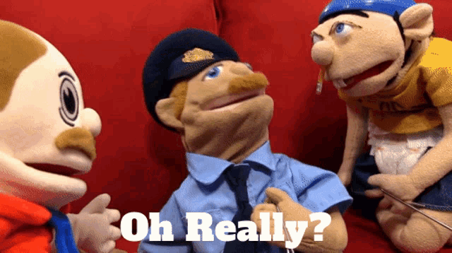 three stuffed animals are sitting on a red couch with the words oh really on the bottom right