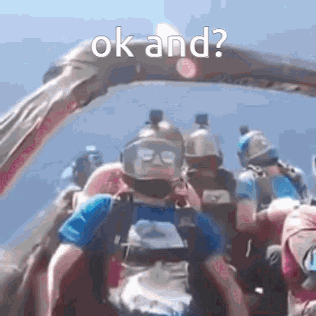 a group of people are jumping out of a parachute with the words ok and written on the bottom