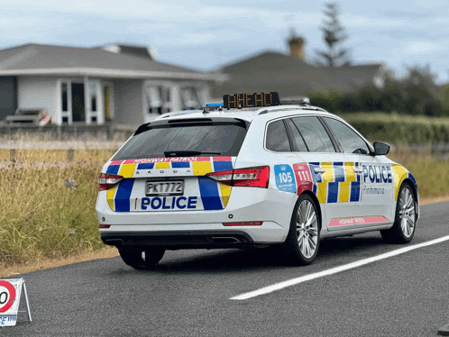 a police car with a sign on top that says the hill