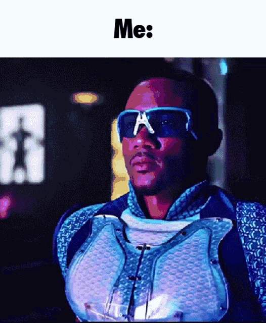 a man wearing sunglasses and a vest says me on the bottom