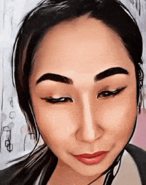a close up of a woman 's face with the eyes closed