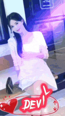 a woman in a white dress is sitting on a bench next to a sign that says devil .