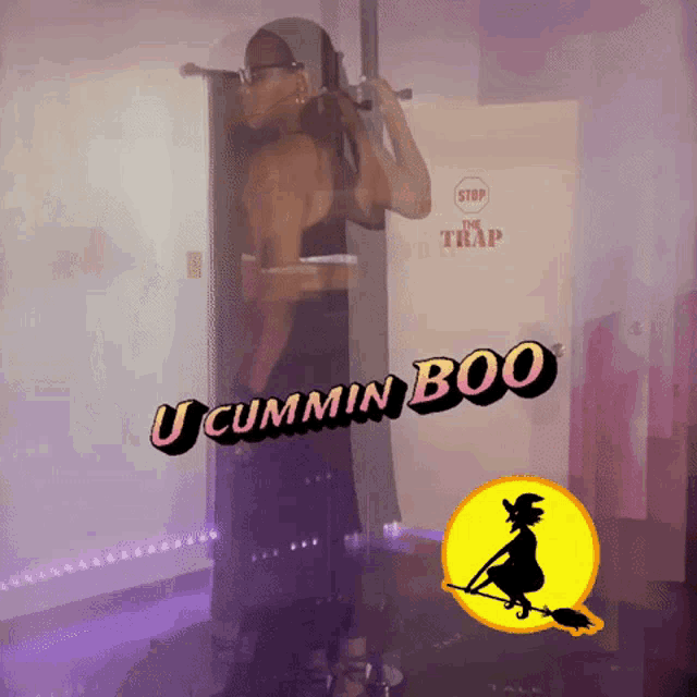 a woman is doing pull ups in front of a stop sign