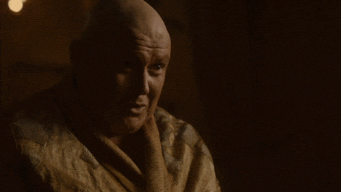 a bald man in a robe with the words well played my lord hand below him