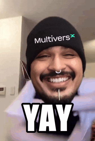 a man wearing a beanie that says multivers x on it