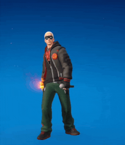 a man in a black jacket and green pants is holding a fireball in his hand