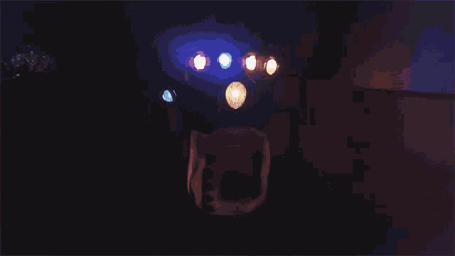 a dark room with a few lights shining on it