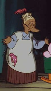 a cartoon character with glasses and an apron with a pink heart on it