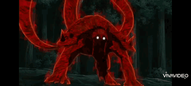 a red monster is standing in the middle of a forest .