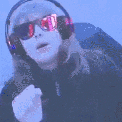 a girl wearing headphones and sunglasses with a pepsi logo on them .