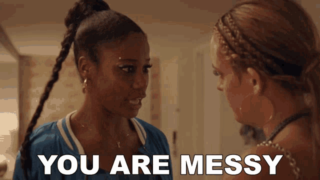 two women are standing next to each other with the words " you are messy " on the bottom