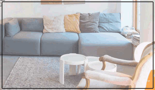 a living room with a couch a chair and a table
