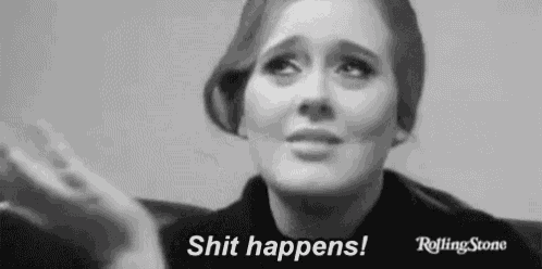a black and white photo of a woman crying with the words `` shit happens '' written next to her .