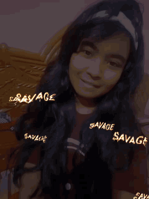 a girl with savage written on her headband