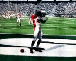 a football player with the number 93 on his jersey is kicking a ball