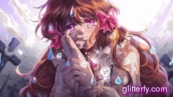 a girl with a flower in her hair is crying in a graveyard .