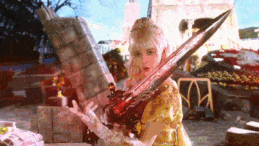 a girl in a yellow dress is holding a sword