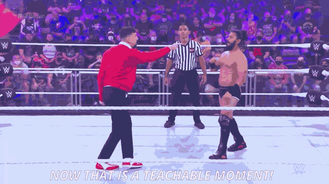 a wrestling match with the words now that is a teachable moment written on the bottom