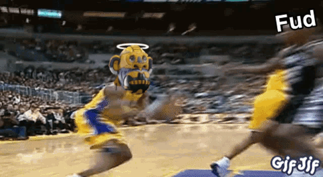 a basketball player wearing a monkey mask is dribbling a ball