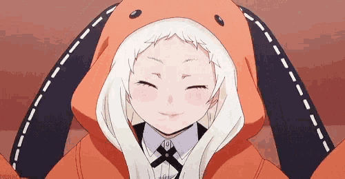 a girl is wearing an orange bunny hooded jacket