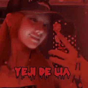 a girl with pink hair is taking a selfie with her phone and the words yeh de ha are visible