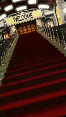 a red carpet leads to a welcome sign