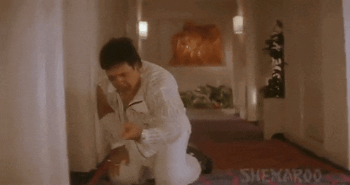 a man kneeling down in a hallway with the words koi system banana chahiye gormint ko