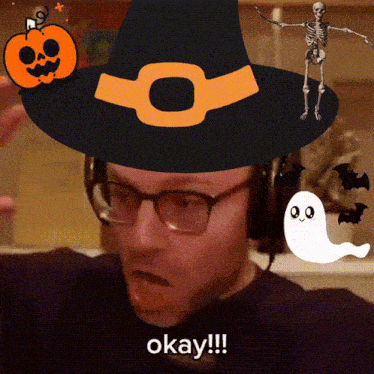 a man wearing a witch hat and headphones says okay