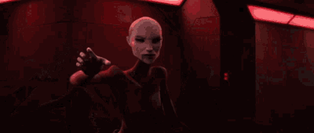 a couple of aliens kissing in a dark room