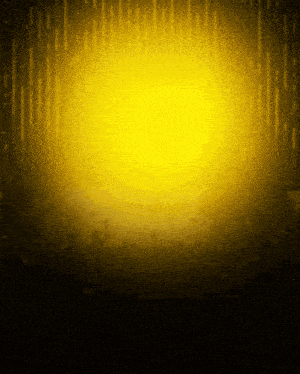 a yellow light is shining through a dark room