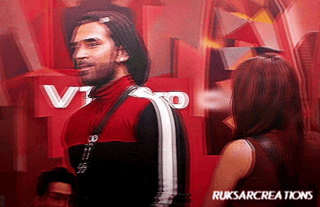 a man in a red jacket stands next to a woman in front of a sign that says ruksarcreations on it