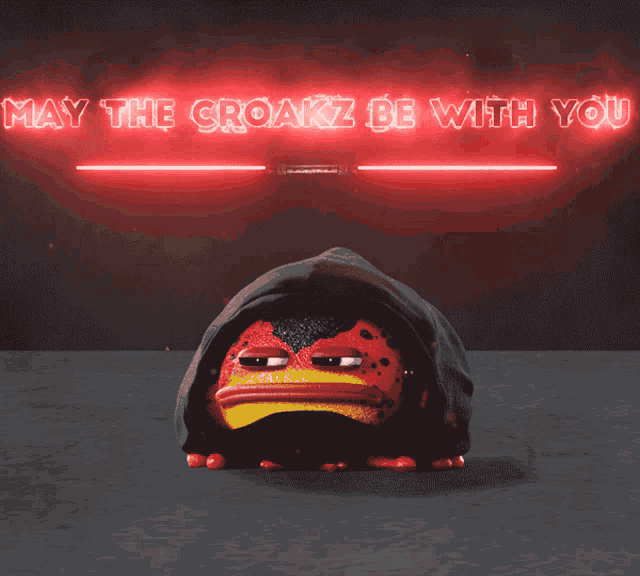 a frog wearing a black hood with the words may the croakz be with you behind it