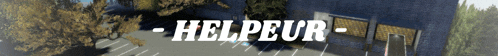 a blurred image of a building with the words helpeur written in white