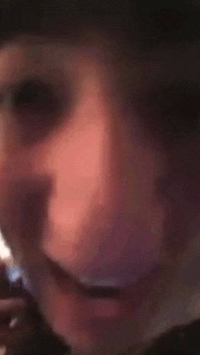 a close up of a person 's face with a circle in the middle