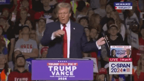a man stands at a podium with a sign that says trump will fix it trump vance 2024