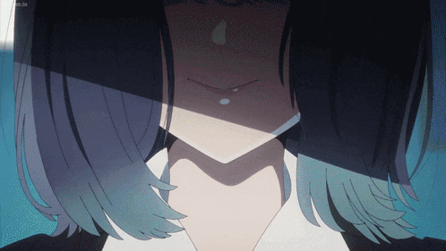 a close up of a girl 's face with a shadow on it