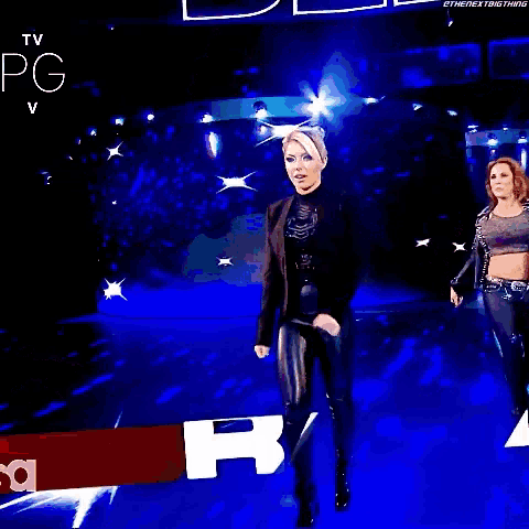 an advertisement for alexa bliss with mickie james nia jax and tamina