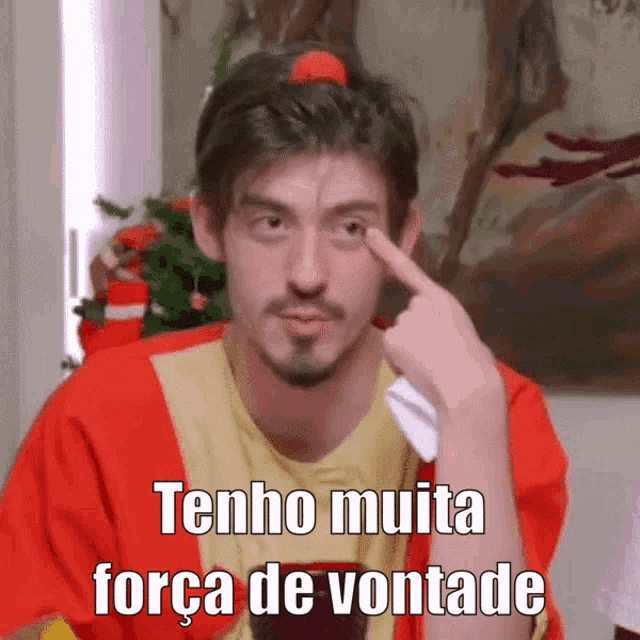 a man is pointing at his eye and says tenho muita força de vontade on the bottom