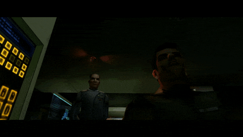a man in a video game is talking to another man in front of a red light