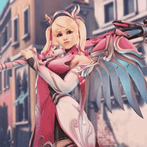 a woman in a pink costume with wings is holding a cane in front of a building .