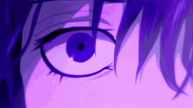 a close up of a person 's eye in a purple light
