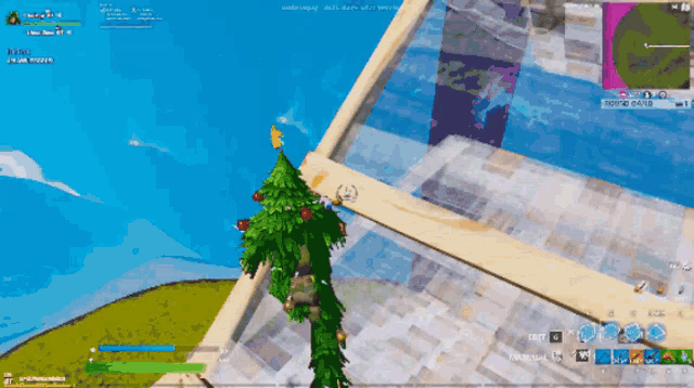 a screenshot of a video game shows a christmas tree on the ground