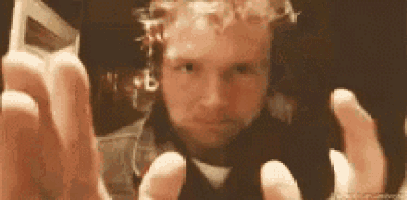 a man is taking a selfie with his cell phone .