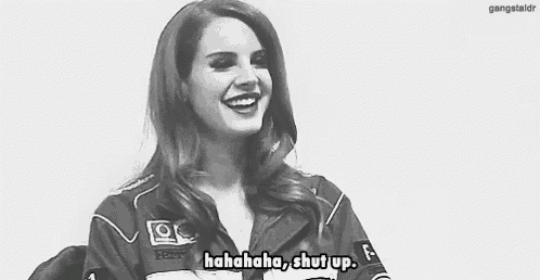 a black and white photo of a woman laughing and saying , `` hahahahaha , shut up . ''