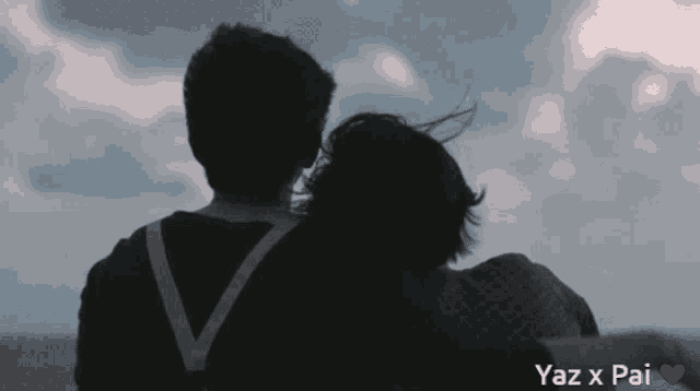 a man and a woman looking at the sky with yaz x pai written on the bottom right