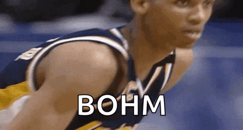 a close up of a basketball player with the word bohm written on it .